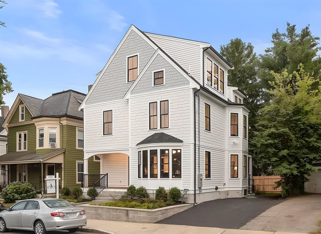 Newly completed white shingled single-family home financed by Origin Funding